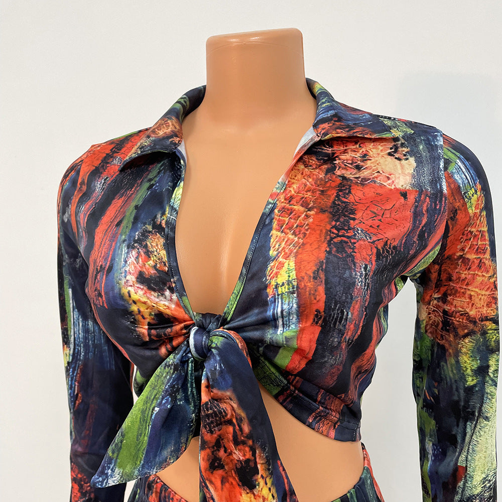 Sexy Tight-Fitting Printed Lace-Up Two-Piece Long-Sleeved Suit Product information: Style: sexy Pattern: Printing Style: pants suit Top style: T-shirt Top sleeve length: long sleeve Pants style: pencil pants Length: trousers Popular elements: bows, prints