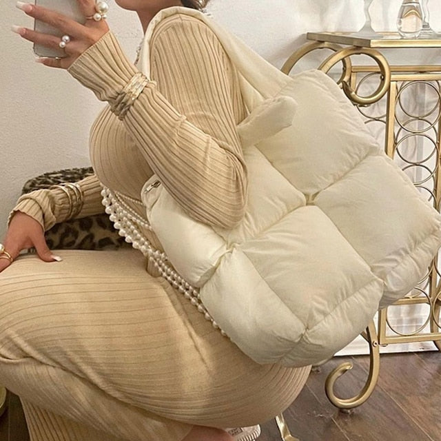 Zipper Cotton-padded Jacket Bag Our stylish and practical Zipper Cotton-padded Jacket Bag is the perfect addition to your autumn or winter wardrobe. Crafted from a durable cotton blend and filled with insulation, this bag effortlessly combines a modern ae