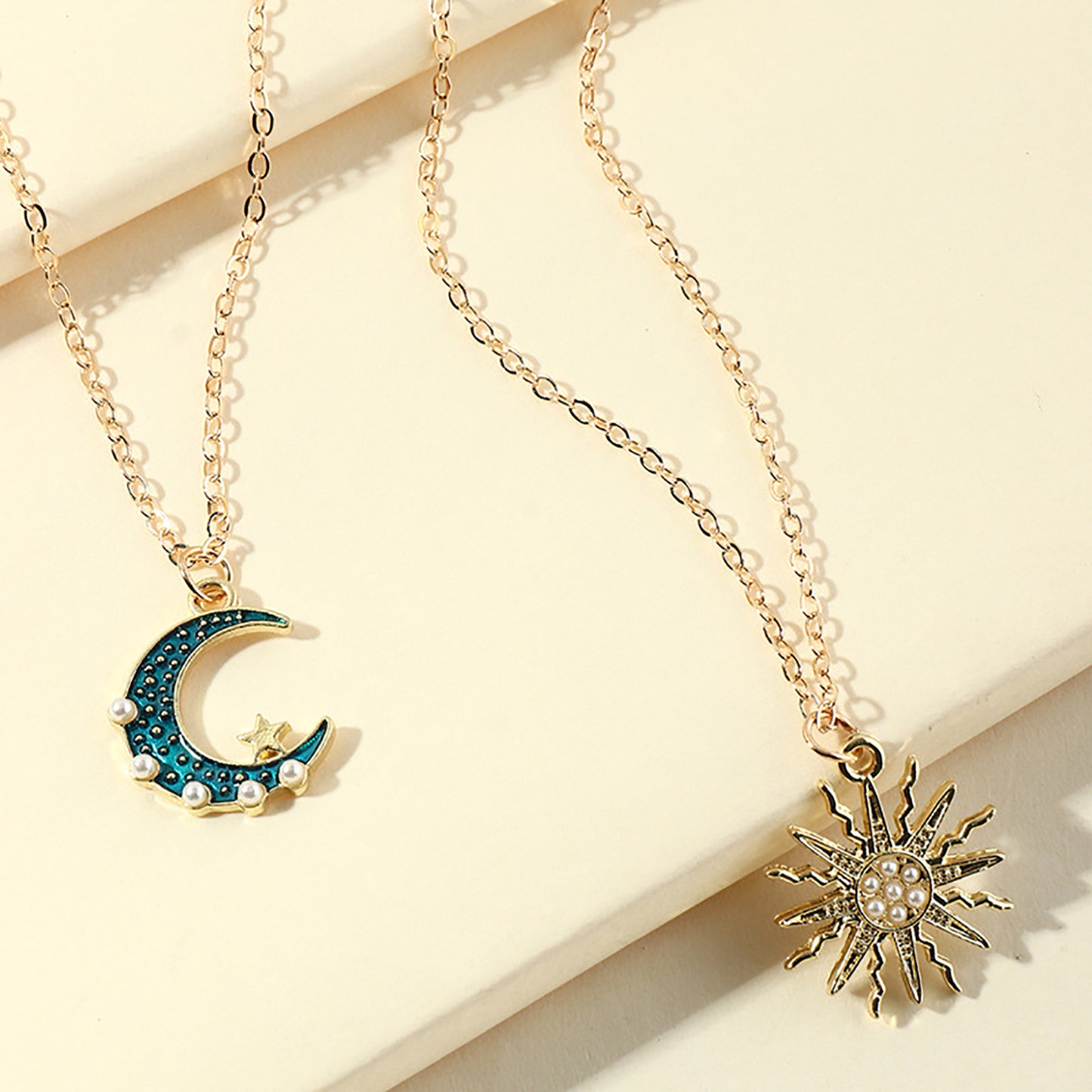 Sun Moon Necklace Blue Gold Stainless Steel Pendant Necklaces Jewelry Product information: Style: European and American Material: Alloy Treatment process: electroplating Modeling: Sun Moon Chain style: water wave chain Whether it is multi-layered: yes Ext