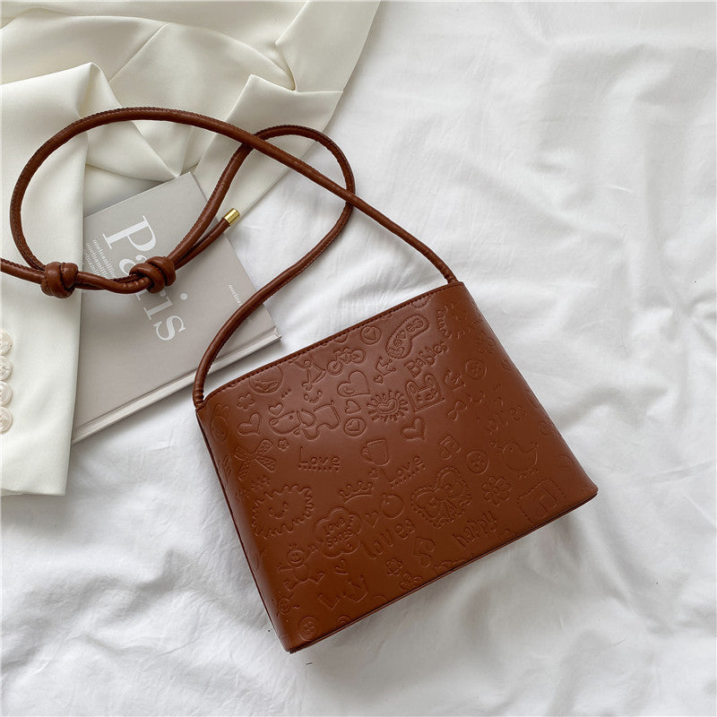 Women"s Bag New Trend Versatile Niche Design Product information: Popular elements: Embossing Color classification: White, black, khaki, brown With or without interlayer: None Whether it can be folded: No Backpack method: Crossbody single shoulder Applica