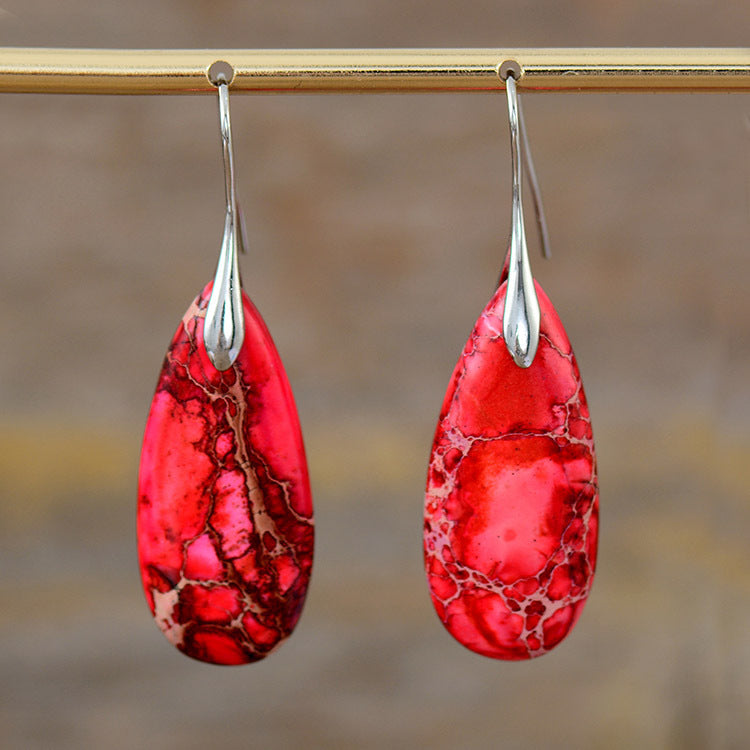 New Bohemian Emperor Stone Water Drop Pendant Earrings Product information: Color: red, purple, blue, orange, red gold ear hook, blue gold ear hook, purple gold ear hook Applicable people: women Material: Emperor Stone Shape: drop-shaped Popular elements: