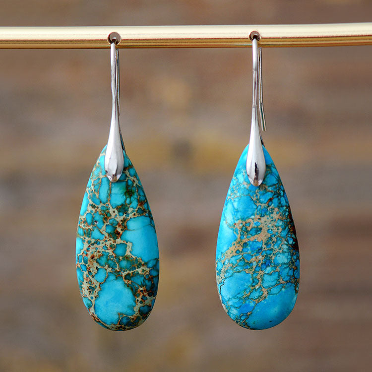 New Bohemian Emperor Stone Water Drop Pendant Earrings Product information: Color: red, purple, color, turquoise blue, turquoise blue gold ear hook, color gold ear hook Applicable people: women Material: Emperor Stone Shape: drop-shaped Popular elements: