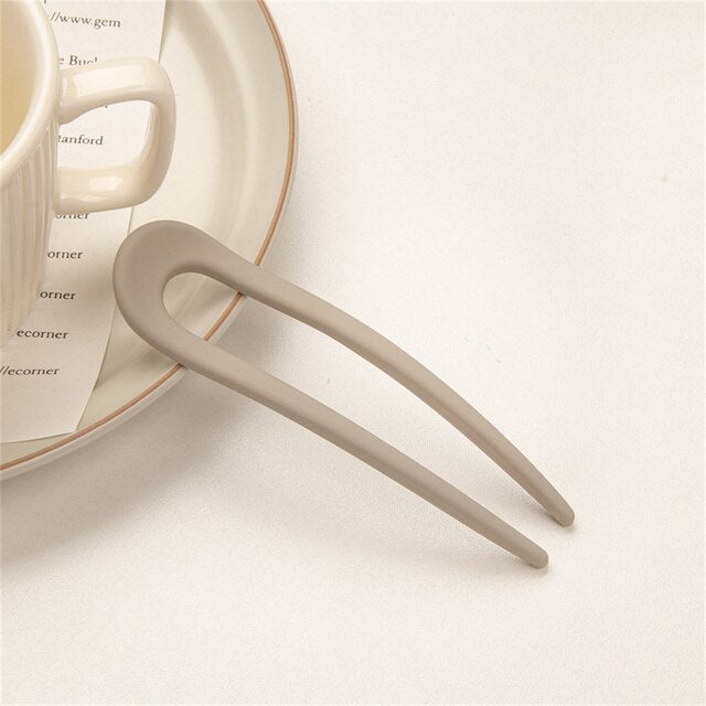 Fashion Candy Color Hair Sticks for Women Elevate your hair game with our Fashion Candy Color Hair Sticks for Women. These Simple Hair Clip Pins come in a variety of vibrant candy colors, adding a playful touch to your hairstyles. Crafted with a minimalis