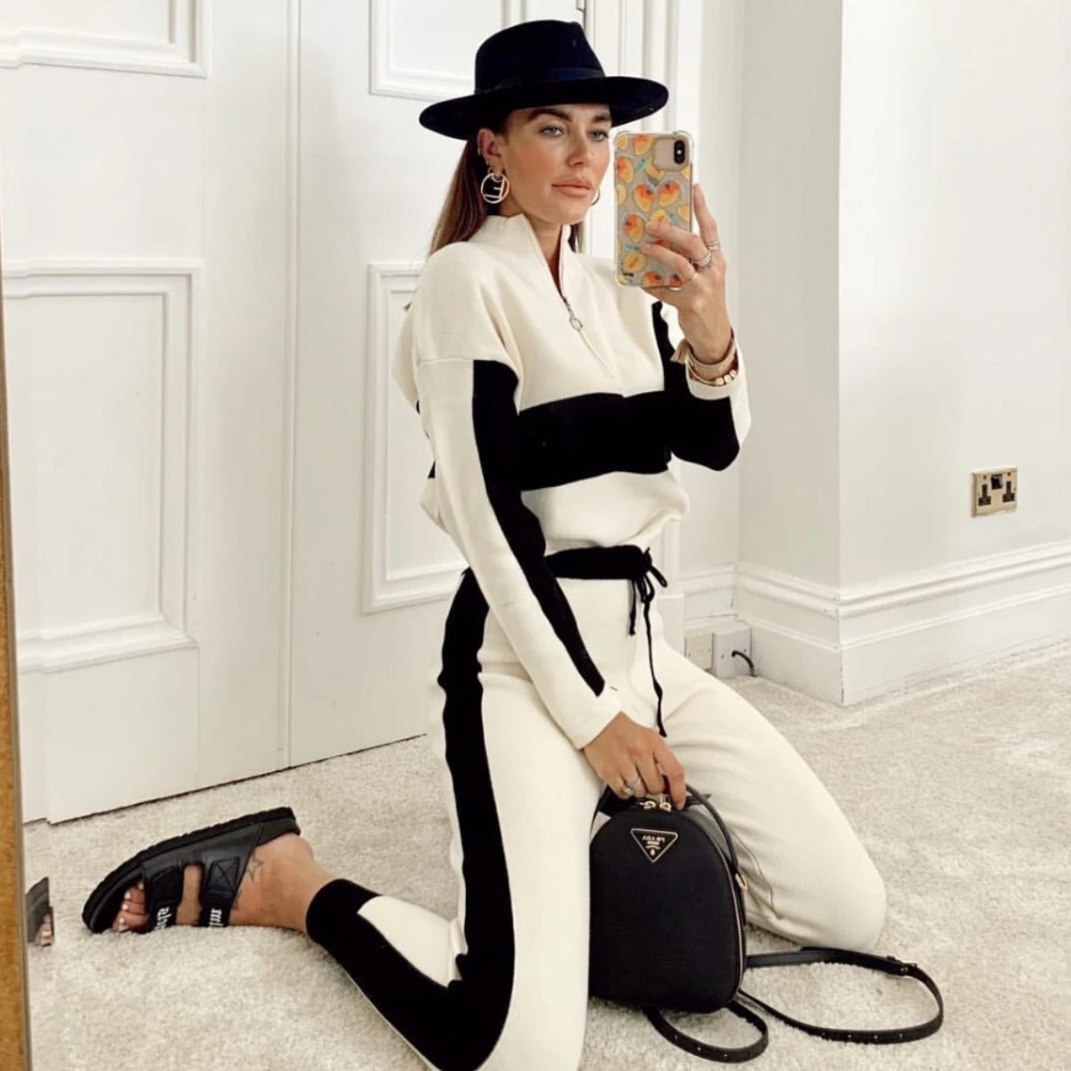 Women's zipper stand collar casual sports suit Style: sports pattern: plain Style: pants suit Top style: coat Pants style: straight pants Pants length: Nine pants Fabric name: chemical fiber blended Main fabric composition: polyester fiber (polyester) The