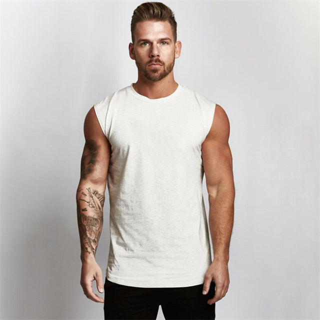 Gym Vest This gym vest is perfect for the man who wants to stay looking good and feeling comfortable while working out. The cotton blend material makes it breathable and easy to move in, while the stylish design ensures you'll always look your best. Wheth