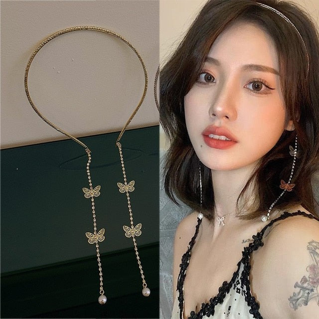 Pearl Butterfly Tassel Headband The Pearl Butterfly Tassel Headband is the perfect way to make a statement at any formal or special occasion. Handcrafted with top-notch attention to detail, this headband features intricate pearl and butterfly designs and