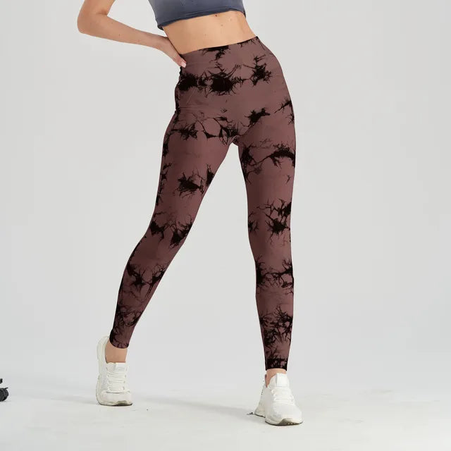 Seamless Tie Dye Leggings This pair of leggings with several features that make them appealing, especially for active and fitness-oriented women. Here's a breakdown of the key elements:Seamless Design: The term "seamless" suggests that the leggings are co
