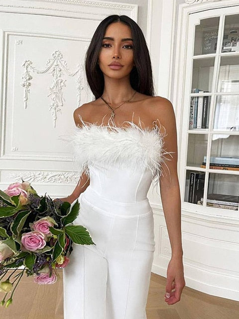 Women Sequined Feather-paneled Jumpsuit Introducing our Women Sequined Feather-paneled Jumpsuit, the epitome of elegance and allure for your 2022 Spring street outfits. This two-piece ensemble features a sexy backless, sleeveless top adorned with shimmeri