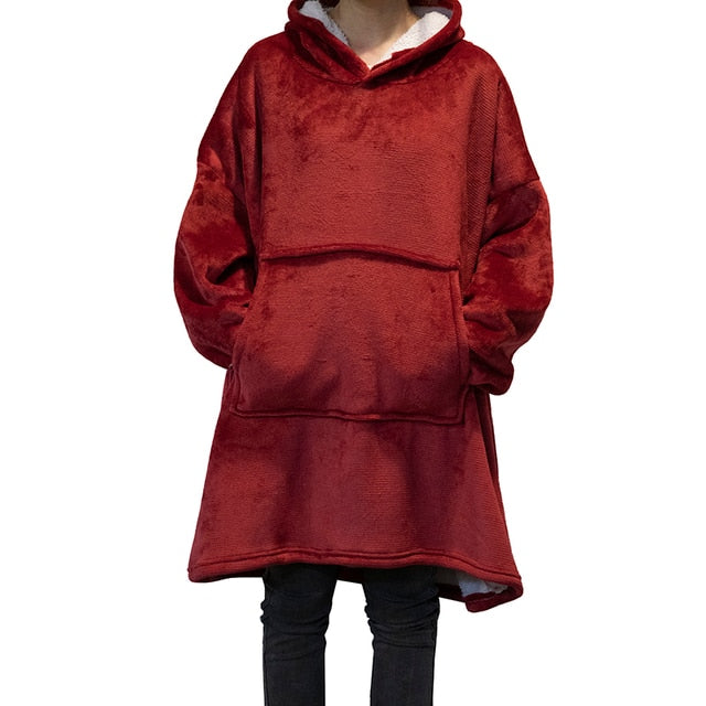 Blanket Hoodie Oversized The Blanket Hoodie Oversized is a stylish and comfortable winter wardrobe essential that will keep you warm during those cold months. Constructed with a high-quality, plush fabric, this oversized hoodie blanket looks great and fee