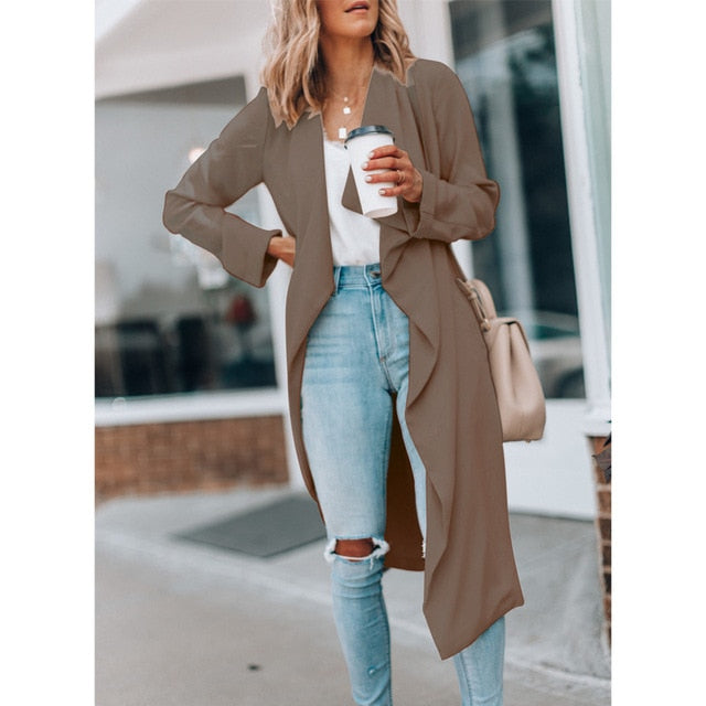 Women's Windbreaker Trench Coat Elevate your spring and autumn wardrobe with our Women's Windbreaker Trench Coat. This versatile piece of outerwear combines timeless style with casual elegance, featuring a solid color design and a classic lapel collar. Wi
