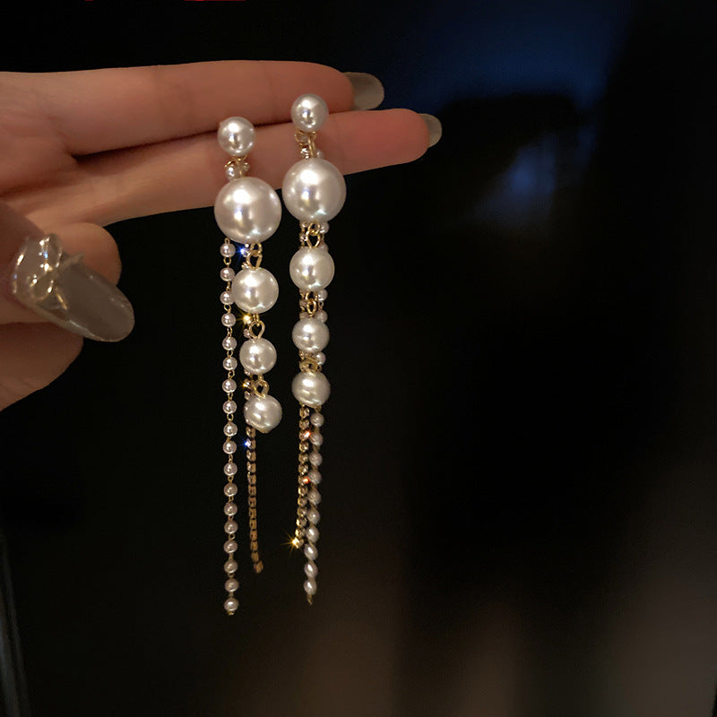 Temperament Pearl Tassel Long Earrings With 925 Silver Needle Fashion Luxury Personalized Earrings For Women Product information: Material: pearl Shape: Geometric Colour:925 silver pin. Earrings Packing list: Earring*1 Pair Product Image: Temperament Pear