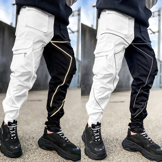 Reflective Cargo Pants Our Reflective Cargo Pants are the perfect choice for the modern man on the go. Designed with style and function in mind, these pants feature multiple reflective pockets that are perfect for storing all of your essentials. Whether y