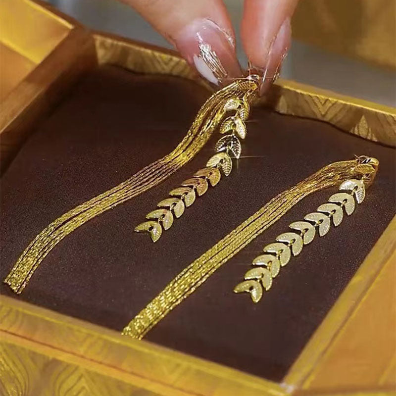 Wheat Long Fringe Earrings Dual-wear Women Product information: Color: Gold Applicable population: Female Material: Copper Shape: Leaves Popular elements: Lines Packing list: Earrings X1 pair Product Image: Wheat Long Fringe Earrings Dual-wear Women Produ