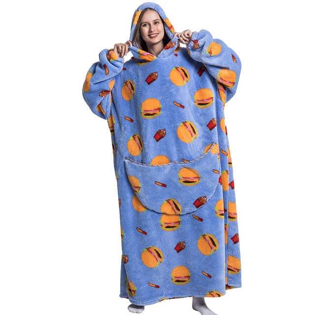 Oversized Wearable TV Blankets Treat yourself to the ultimate in coziness with our Oversized Wearable TV Blanket. This piece of apparel is uniquely designed for maximum comfort and warmth. It boasts a spacious, hooded fit that makes wearing and taking off